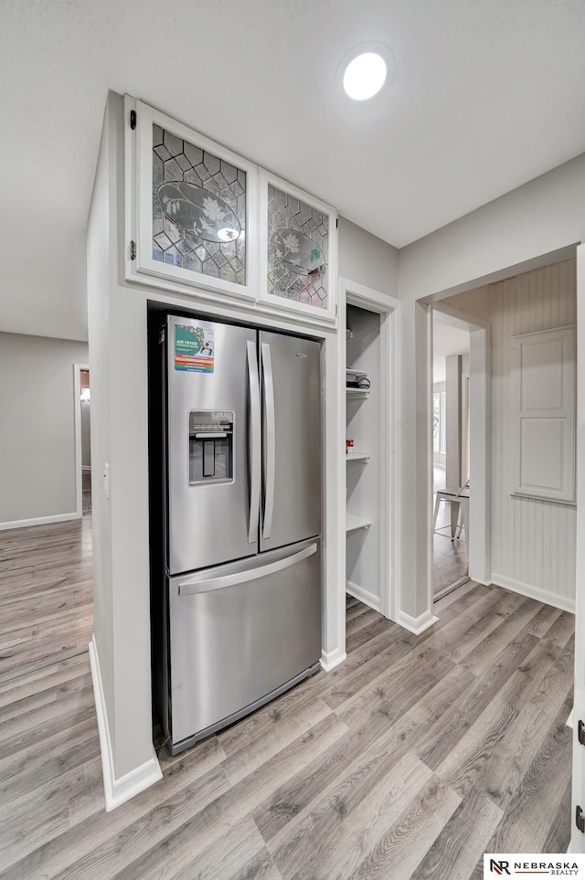 6844 Laurent Cir, Lincoln, NE 68526 - kitchen with stainless steel refrigerator with ice dispenser, baseboards, and light wood-type flooring
