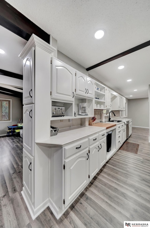 6844 Laurent Cir, Lincoln, NE 68526 - kitchen featuring open shelves, a sink, light wood-type flooring, recessed lighting, and white cabinets