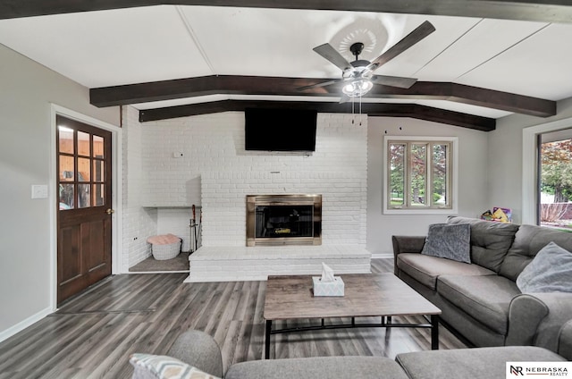 6844 Laurent Cir, Lincoln, NE 68526 - living room featuring a brick fireplace, baseboards, wood finished floors, and a ceiling fan