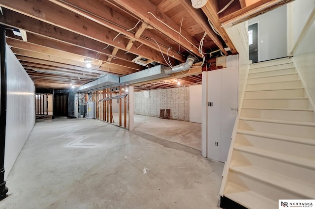 6844 Laurent Cir, Lincoln, NE 68526 - unfinished basement with stairs and gas water heater