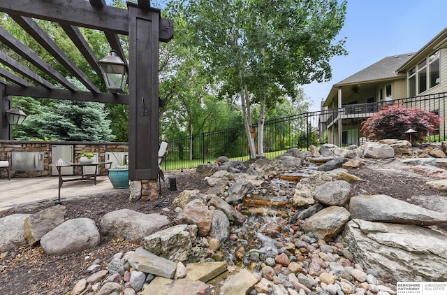 1419 N 188th St, Elkhorn, NE 68022 - view of yard featuring a pergola and a patio