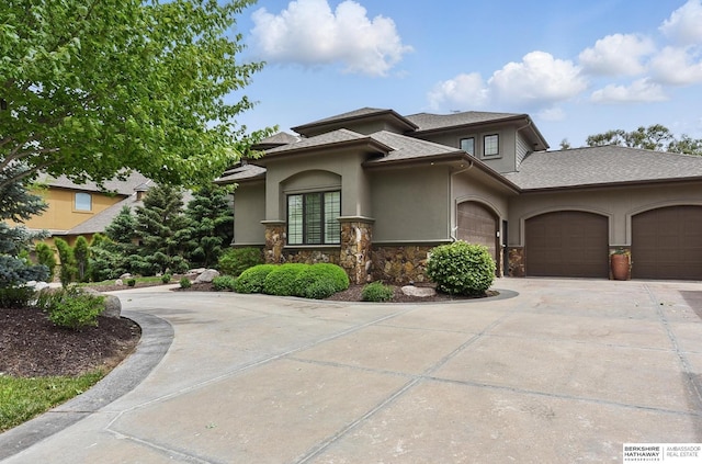 1419 N 188th St, Elkhorn, NE 68022 - view of front of property featuring stucco siding, an attached garage, driveway, stone siding, and roof with shingles