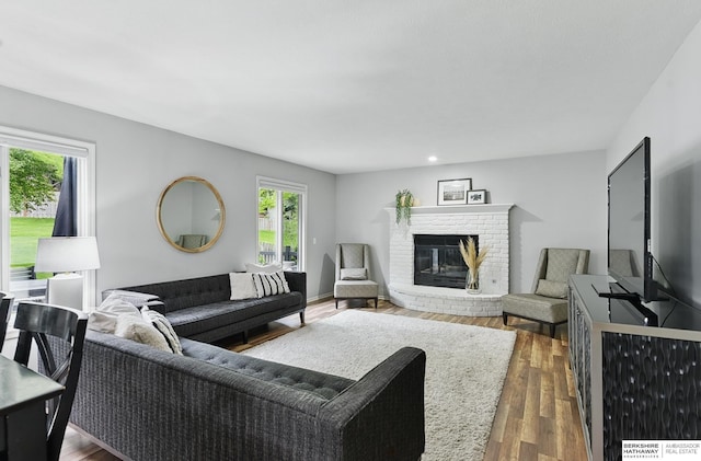 1725 N 162nd St, Omaha, NE 68118 - living area featuring wood finished floors and a fireplace