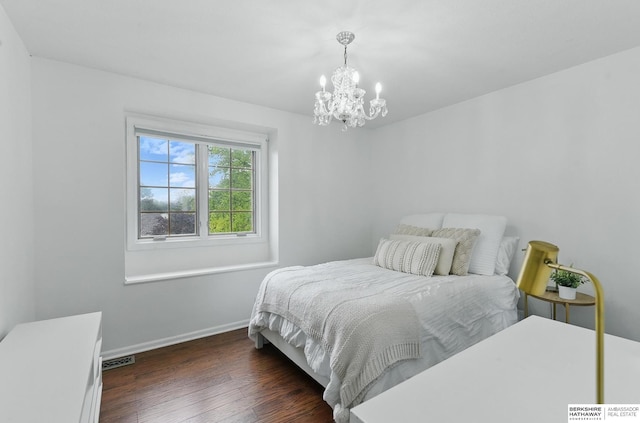 1725 N 162nd St, Omaha, NE 68118 - bedroom with wood finished floors, a chandelier, and baseboards