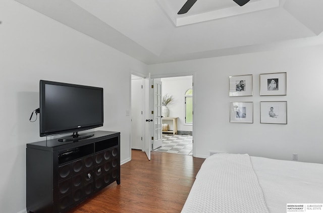 1725 N 162nd St, Omaha, NE 68118 - bedroom featuring dark wood-style flooring, a tray ceiling, baseboards, and a ceiling fan