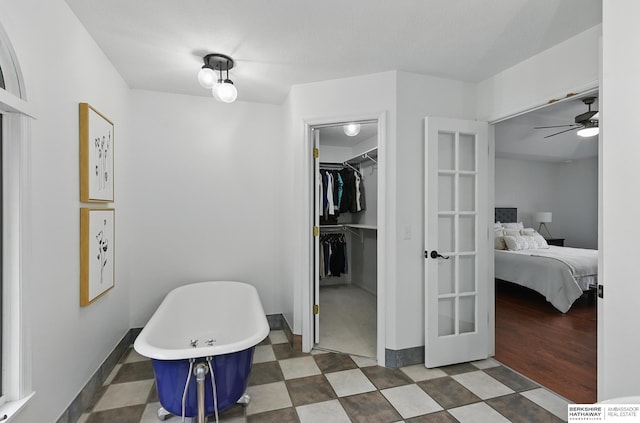 1725 N 162nd St, Omaha, NE 68118 - bedroom featuring a walk in closet, baseboards, and a closet