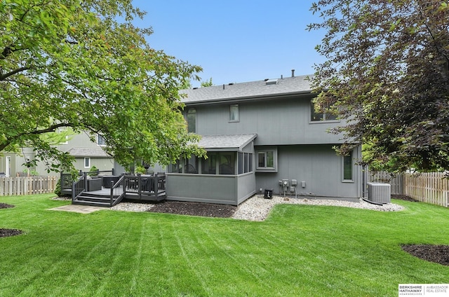 1725 N 162nd St, Omaha, NE 68118 - back of house with a sunroom, a shingled roof, a wooden deck, and cooling unit
