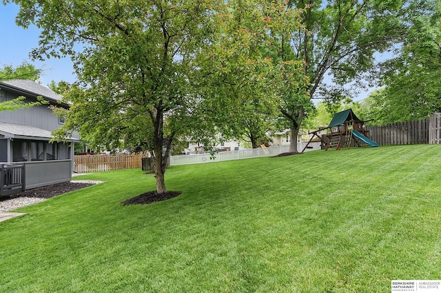 1725 N 162nd St, Omaha, NE 68118 - view of yard with a playground and a sunroom