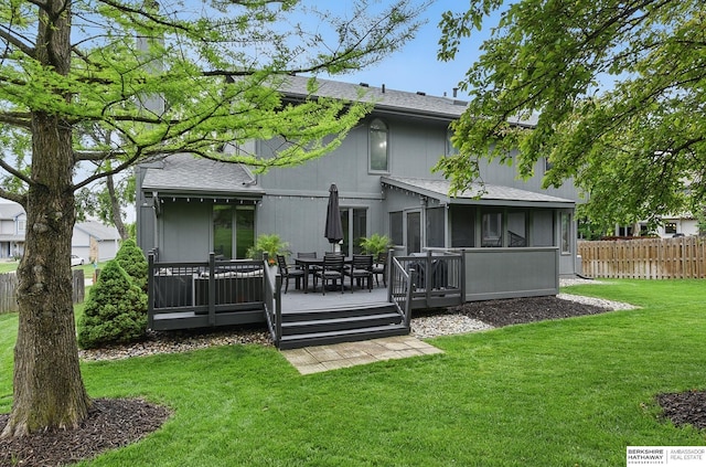 1725 N 162nd St, Omaha, NE 68118 - rear view of house featuring a wooden deck, a sunroom, a shingled roof, and outdoor dining area