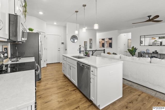 7717 N 108th St, Omaha, NE 68142 - kitchen featuring appliances with stainless steel finishes, a sink, a ceiling fan, white cabinets, and light wood-type flooring