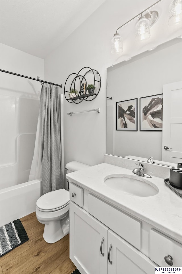 7717 N 108th St, Omaha, NE 68142 - bathroom featuring toilet, vanity, wood finished floors, and shower / bath combo