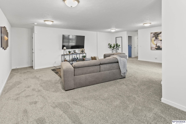 7717 N 108th St, Omaha, NE 68142 - living room featuring carpet floors, baseboards, and a textured ceiling