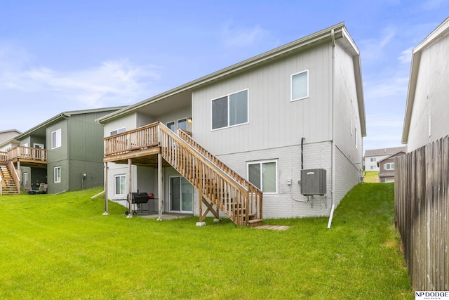 7717 N 108th St, Omaha, NE 68142 - back of house with stairs, a wooden deck, and a yard