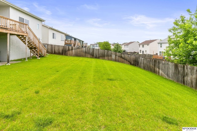 7717 N 108th St, Omaha, NE 68142 - view of yard featuring a residential view, stairway, and a deck