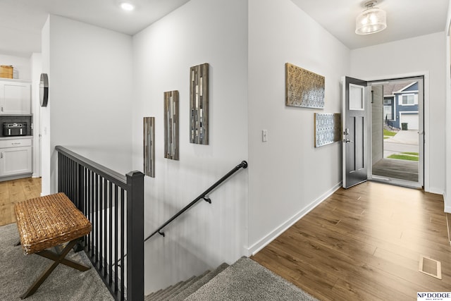 7717 N 108th St, Omaha, NE 68142 - entrance foyer with wood finished floors, baseboards, and recessed lighting