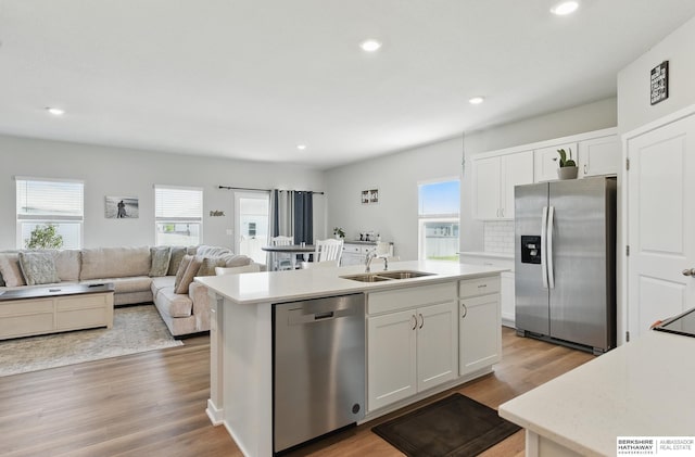 6312 Centennial Rd, Papillion, NE 68157 - kitchen featuring appliances with stainless steel finishes, a sink, a kitchen island with sink, light countertops, and recessed lighting