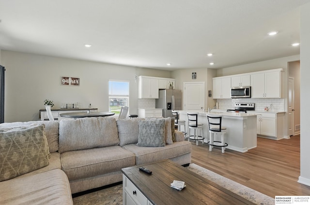6312 Centennial Rd, Papillion, NE 68157 - living room with recessed lighting and light wood-style flooring