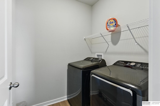 6312 Centennial Rd, Papillion, NE 68157 - washroom with washer and dryer, baseboards, and wood finished floors