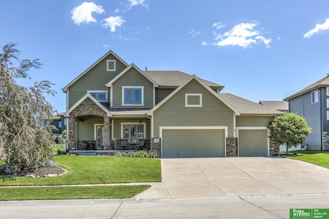 10311 S 124th St, Papillion, NE 68046 - craftsman house with covered porch, a front lawn, stone siding, driveway, and a garage