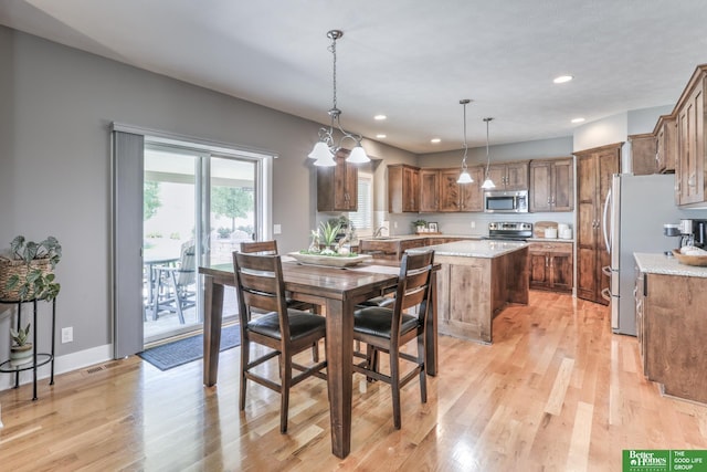 10311 S 124th St, Papillion, NE 68046 - dining space with light wood-style flooring, recessed lighting, a chandelier, and baseboards