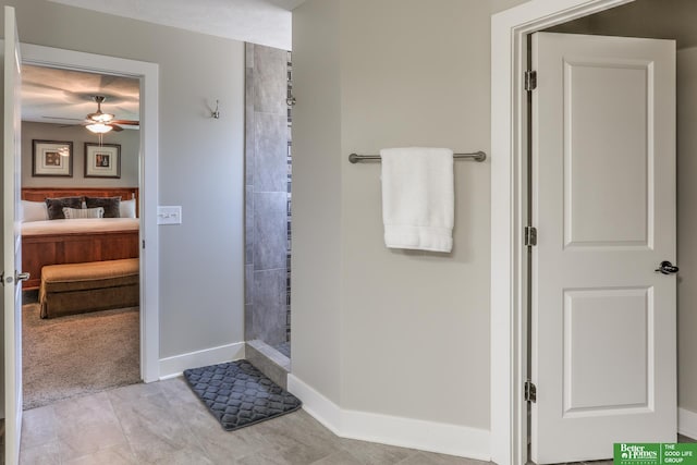 10311 S 124th St, Papillion, NE 68046 - full bathroom with tiled shower, connected bathroom, baseboards, a ceiling fan, and tile patterned flooring