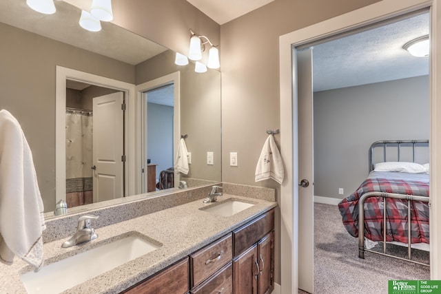 10311 S 124th St, Papillion, NE 68046 - bathroom with double vanity, connected bathroom, and baseboards