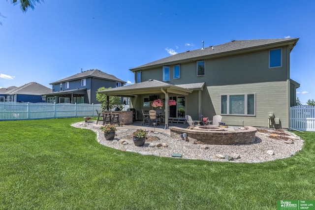 10311 S 124th St, Papillion, NE 68046 - rear view of house with a patio and a fire pit