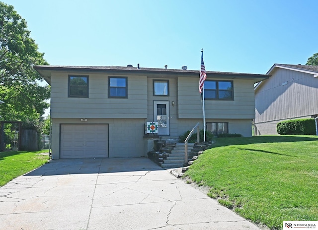 4841 N 130th Cir, Omaha, NE 68164 - split foyer home featuring a front lawn, a garage, and concrete driveway