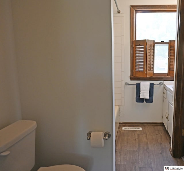 4841 N 130th Cir, Omaha, NE 68164 - full bath featuring toilet, vanity, wood finished floors, and baseboards