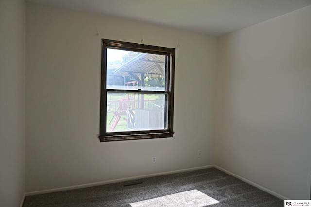 4841 N 130th Cir, Omaha, NE 68164 - empty room with dark carpet and baseboards