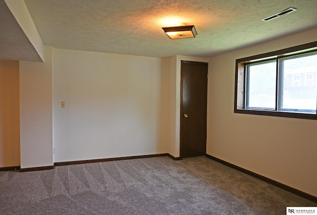 4841 N 130th Cir, Omaha, NE 68164 - unfurnished room with carpet, a textured ceiling, and baseboards