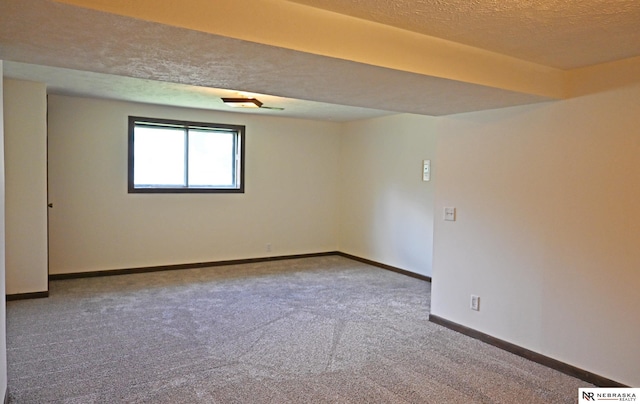 4841 N 130th Cir, Omaha, NE 68164 - spare room featuring carpet flooring, a textured ceiling, and baseboards