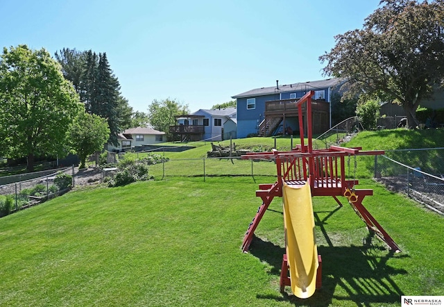 4841 N 130th Cir, Omaha, NE 68164 - view of yard featuring a wooden deck, a playground, and stairs