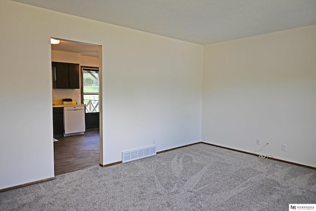 4841 N 130th Cir, Omaha, NE 68164 - unfurnished room with dark carpet and baseboards
