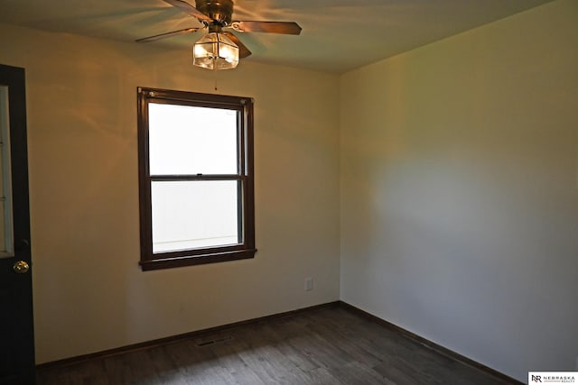 4841 N 130th Cir, Omaha, NE 68164 - unfurnished room featuring dark wood-style flooring, baseboards, and a ceiling fan