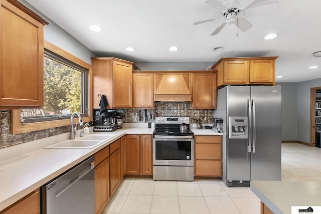 9521 N 140th St, Waverly, NE 68462 - kitchen with stainless steel appliances, wall chimney exhaust hood, a sink, backsplash, and light tile patterned floors