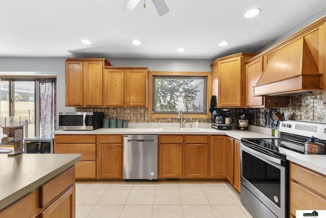 9521 N 140th St, Waverly, NE 68462 - kitchen featuring stainless steel appliances, a sink, custom range hood, tasteful backsplash, and recessed lighting