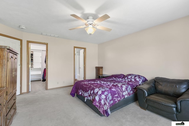 9521 N 140th St, Waverly, NE 68462 - bedroom with light colored carpet, a walk in closet, baseboards, a closet, and ceiling fan