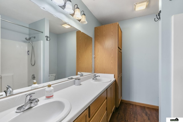 9521 N 140th St, Waverly, NE 68462 - full bath with double vanity, wood finished floors, a shower, and toilet