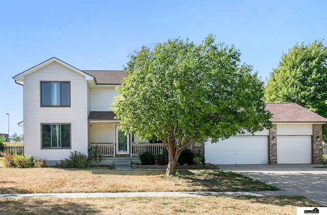 9521 N 140th St, Waverly, NE 68462 - view of front of home with a porch, concrete driveway, a garage, and a shingled roof