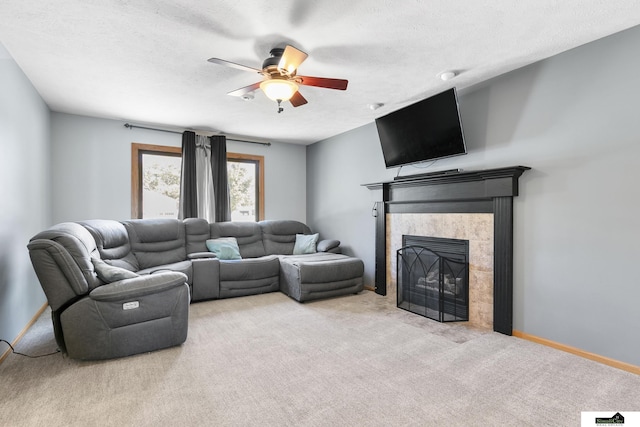 9521 N 140th St, Waverly, NE 68462 - living area featuring a ceiling fan, carpet flooring, a fireplace, baseboards, and a textured ceiling