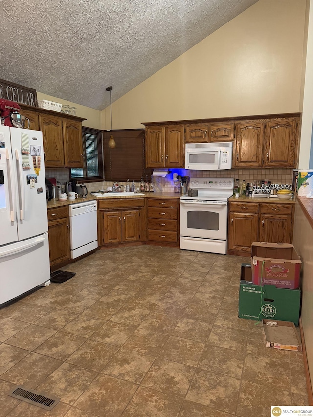 826 Hidden Hills Dr, Bellevue, NE 68005 - kitchen with white appliances, vaulted ceiling, decorative backsplash, a textured ceiling, and a sink
