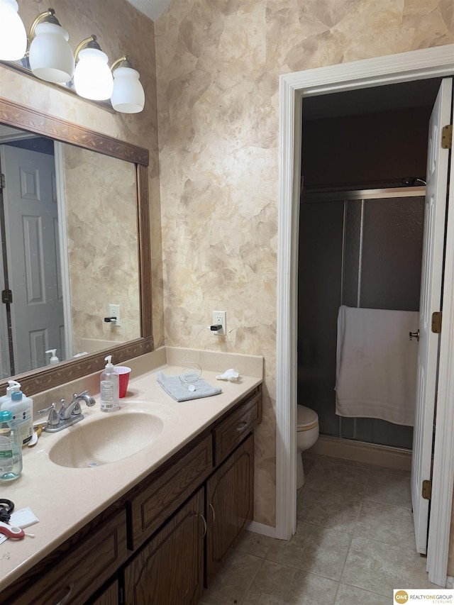 826 Hidden Hills Dr, Bellevue, NE 68005 - full bathroom with toilet, vanity, tile patterned flooring, and a shower
