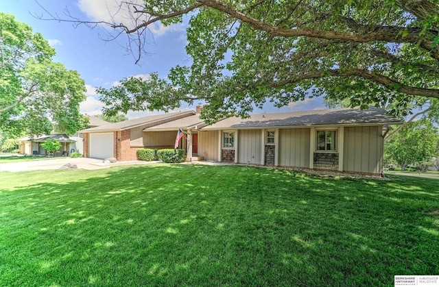 1915 S 131st Ave, Omaha, NE 68144 - ranch-style home featuring concrete driveway, a garage, a front lawn, and a chimney