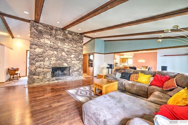 1915 S 131st Ave, Omaha, NE 68144 - living area with wood finished floors, beam ceiling, and a fireplace