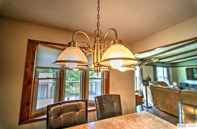 1915 S 131st Ave, Omaha, NE 68144 - dining space with a chandelier and a textured ceiling