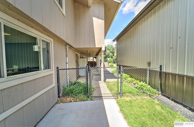 1915 S 131st Ave, Omaha, NE 68144 - view of side of home featuring a gate and a patio area