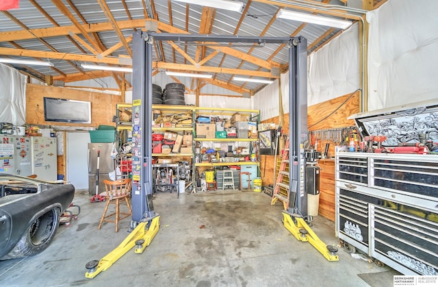 1915 S 131st Ave, Omaha, NE 68144 - garage with a workshop area and freestanding refrigerator