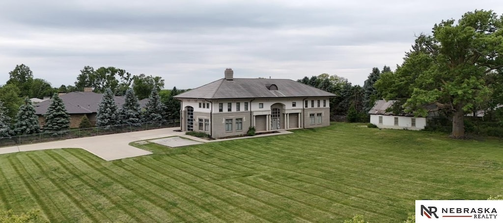 412 N 96th St, Omaha, NE 68114 - back of house featuring a patio, a chimney, and an outdoor structure