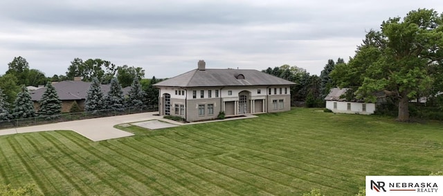 412 N 96th St, Omaha, NE 68114 - back of house featuring a patio, a chimney, and an outdoor structure